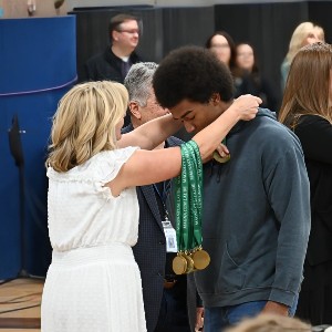 Student receiving medal